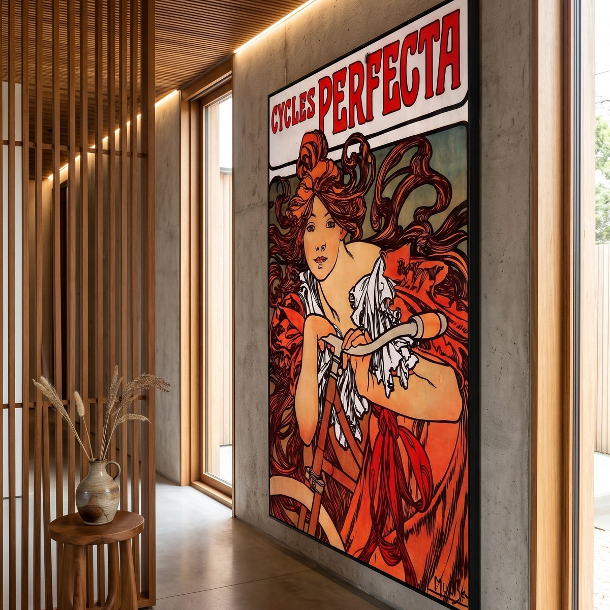 Cycles Perfecta by Alphonse Mucha — large red and orange Art Nouveau canvas art on a hallway wall