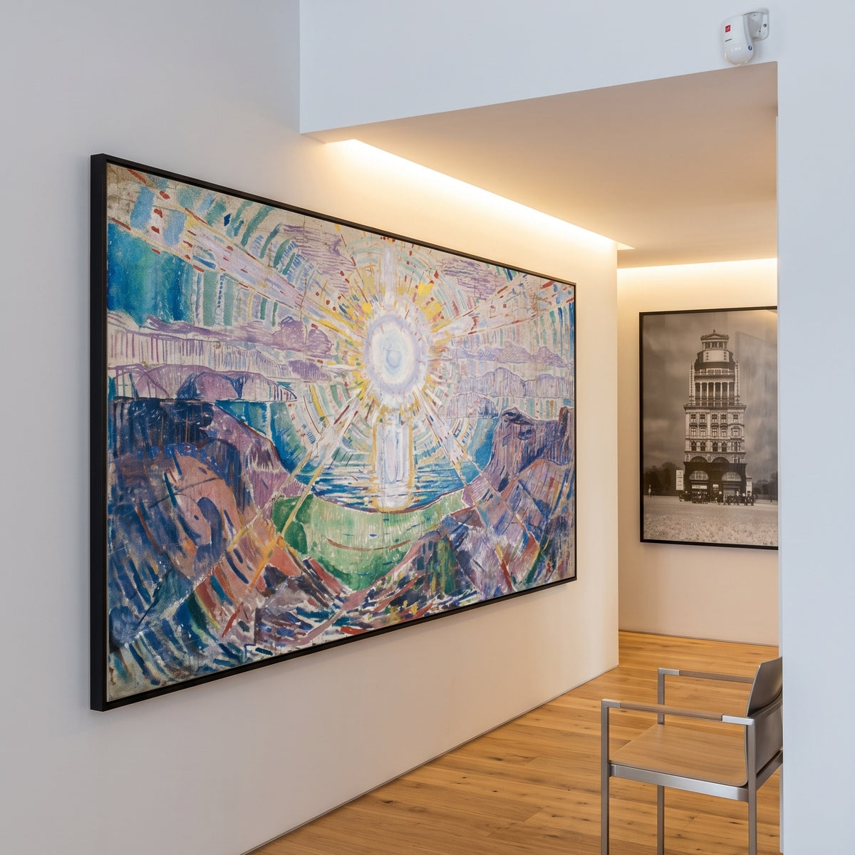 The Sun by Edvard Munch — large purple and blue Expressionist canvas art on a living room wall