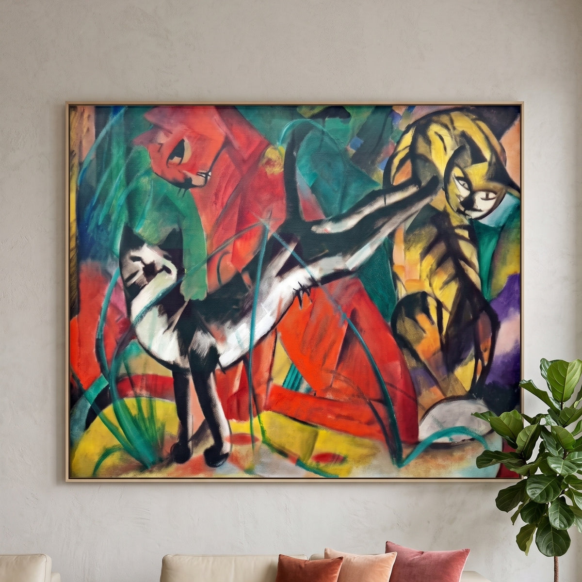 Three Cats by Franz Marc — large red and yellow Expressionist Abstract canvas art on a living room wall