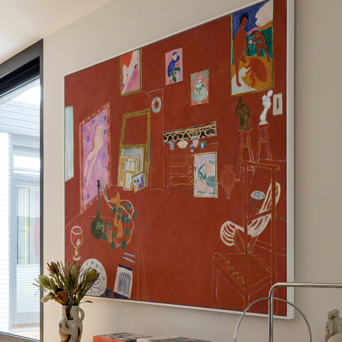 The Red Studio by Henri Matisse — large red Modern Abstract canvas art on a living room wall